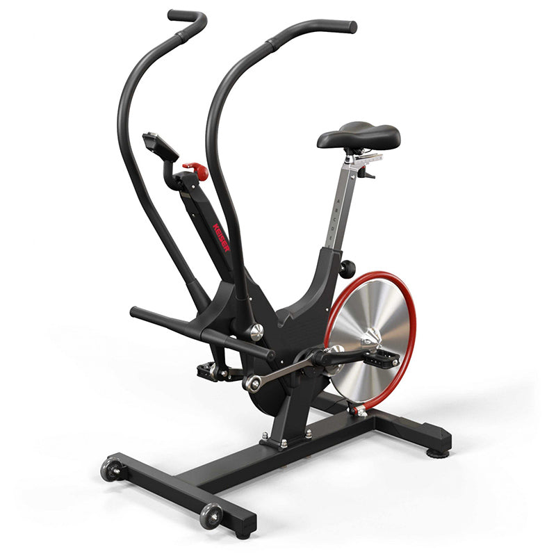 Keiser M3i Total Body Trainer elliptical exercise bike with a black frame and red accents from the left side on a white background