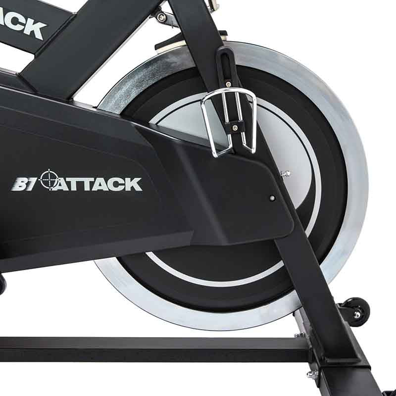 Close-up of a B1 Attack exercise bike with a focus on the wheel and frame.