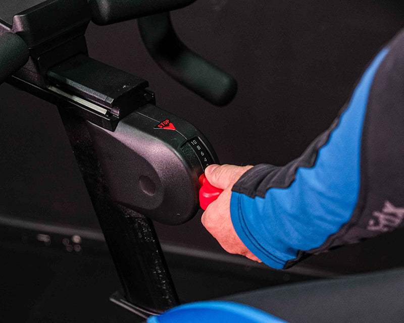 Close-up hand using the resistance lever in red