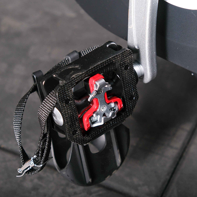 Close up of the Gym Gear M Sport Elite Indoor Cycle foot pedal and locking cleat pedal in black and red