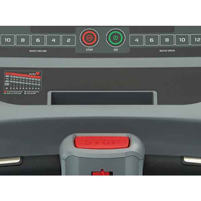 Control panel of a Gym Gear T98 Treadmill with buttons and display.
