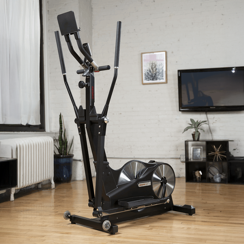 Keiser M5i Strider Elliptical Machine in Black. Full view of the machine in a home setting.
