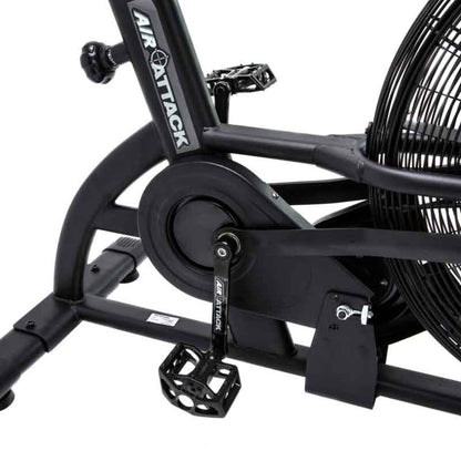 Attack Fitness Fan Air Bike in Black on a white background. Close up of the pedals