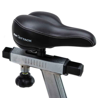 Attack Fitness Fan Air Bike in Black on a white background. Close up of the saddle with adjustable mechanism
