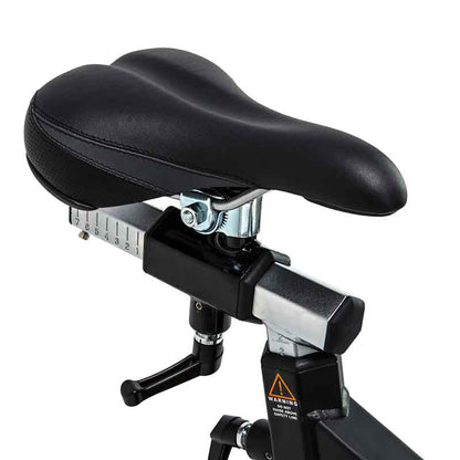 Attack Fitness Spin Attack B1 Indoor Cycle in black. Close up of the Bicycle seat post with adjustable mechanism on a white background