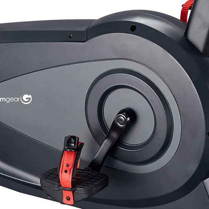 Close-up of the Gym Gear C97 Upright exercise bikes pedals with red support straps on a white background