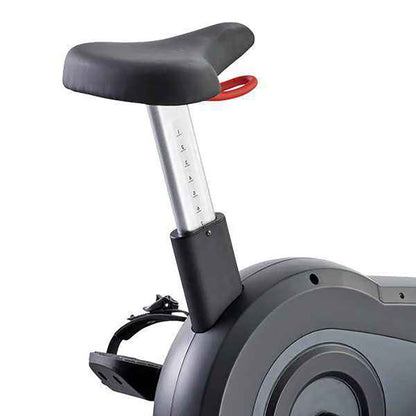 Close-up of the Gym Gear C98e Upright exercise Bike seat post with a adjustable height with a white background