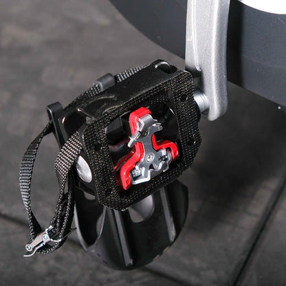 Close up of the Gym Gear M Sport Elite Indoor Cycle foot pedal and locking cleat pedal in black and red