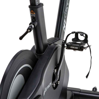 Attack Fitness Spin Attack M1 Indoor Cycle exercise bike in Black, Close-up of a stationary bike pedals 