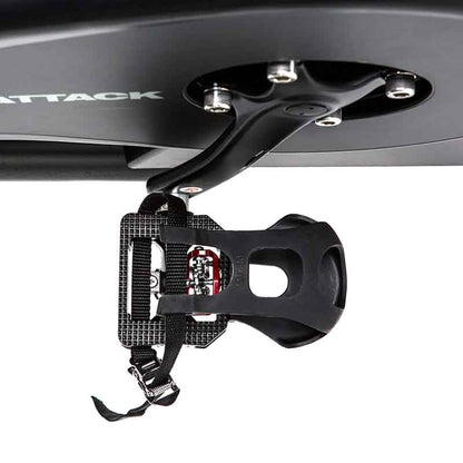 Close-up of a black bike pedal from a top view on a white background