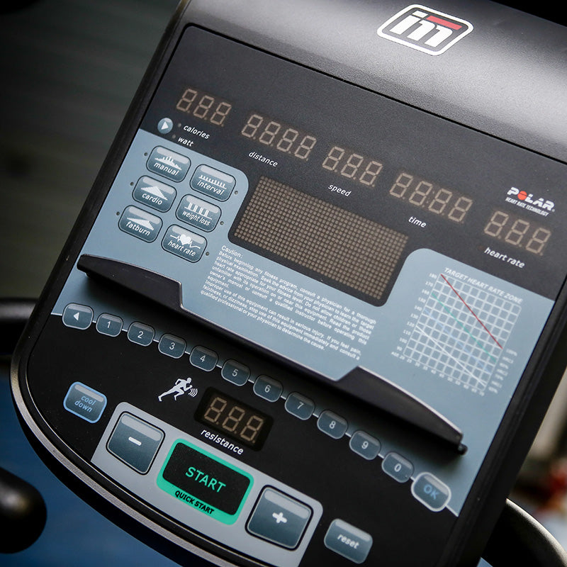 Impulse RU700 Upright exercise Bike Close-up of the console with digital display and control buttons.