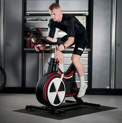 Man exercising on the Wattbike pro trainer exercise bike  in a home setting