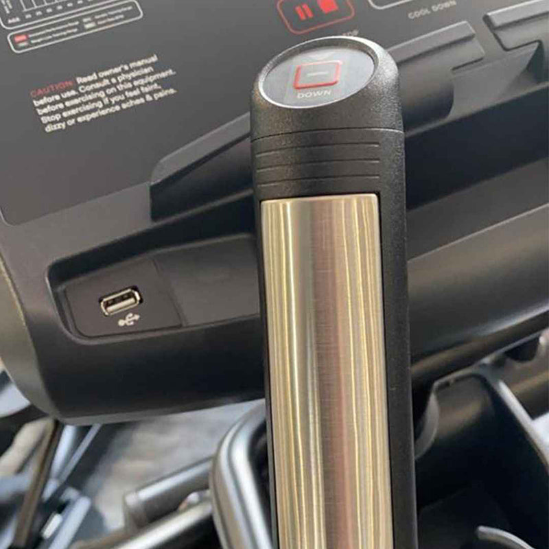 Metallic handlebar with tension controls on the handle of a Gym Gear X98s Cross Trainer with a black grip 