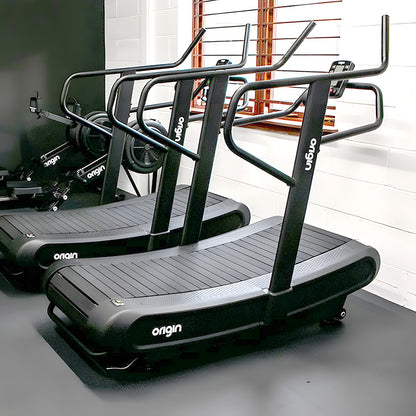 Origin Storm Curved Treadmill Black treadmill with 'Origin' branding, Full view of the product in a gym studio 